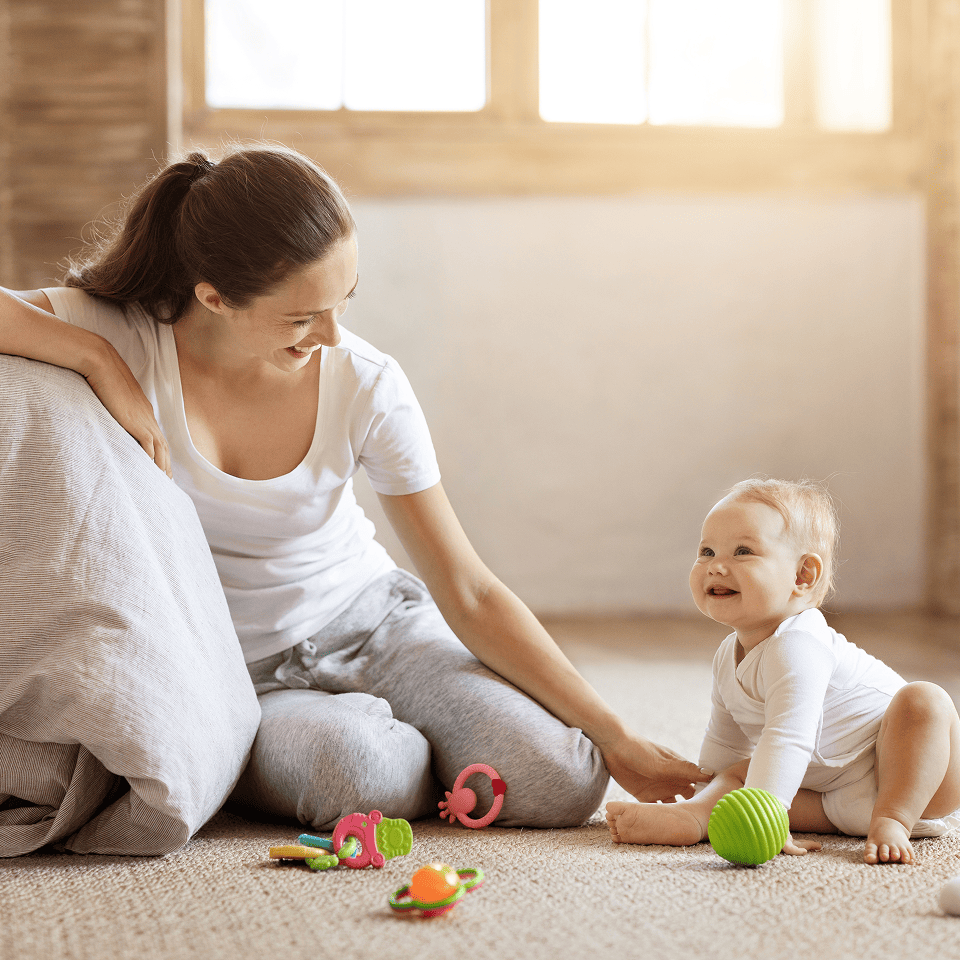 Mother and baby in clean living room